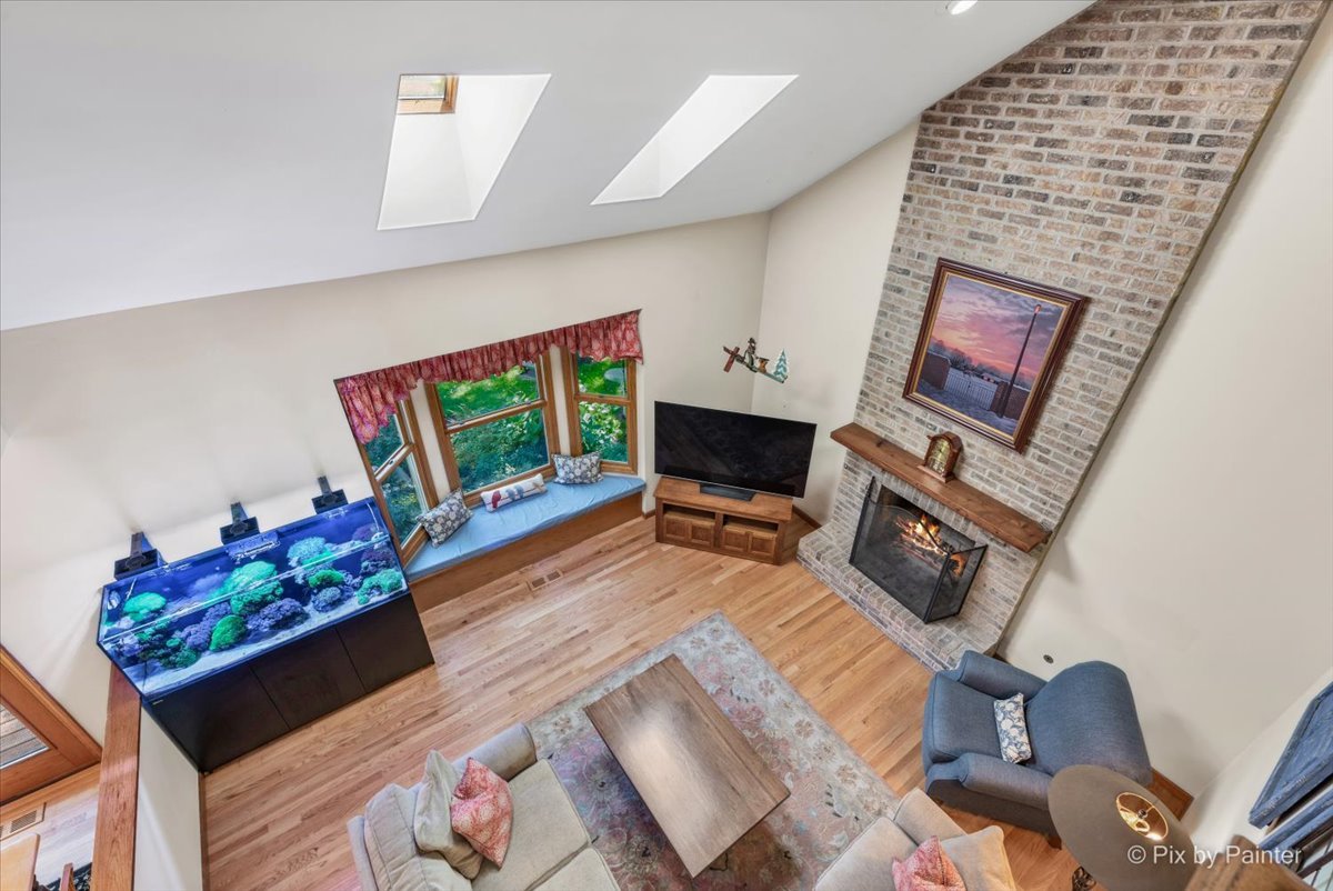28683 Rivers Edge Drive Cary, IL 60013 - Photo 14 of 31 a living room with furniture fireplace and flat screen tv