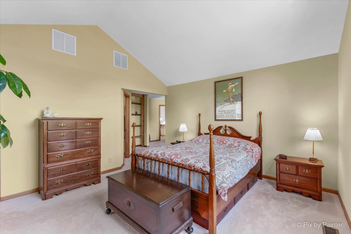 28683 Rivers Edge Drive Cary, IL 60013 - Photo 16 of 31 a bedroom with a bed and a dresser