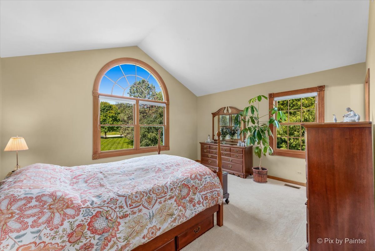 28683 Rivers Edge Drive Cary, IL 60013 - Photo 17 of 31 a bedroom with a bed and a window
