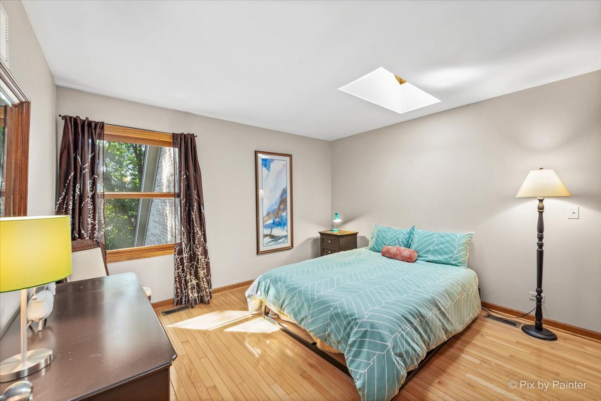 28683 Rivers Edge Drive Cary, IL 60013 - Photo 20 of 31 a bedroom with a bed and a lamp next to a window