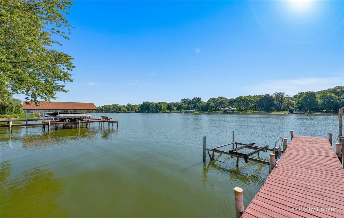 28683 Rivers Edge Drive Cary, IL 60013 - Photo 28 of 31 a view of a lake with boats and trees in the background