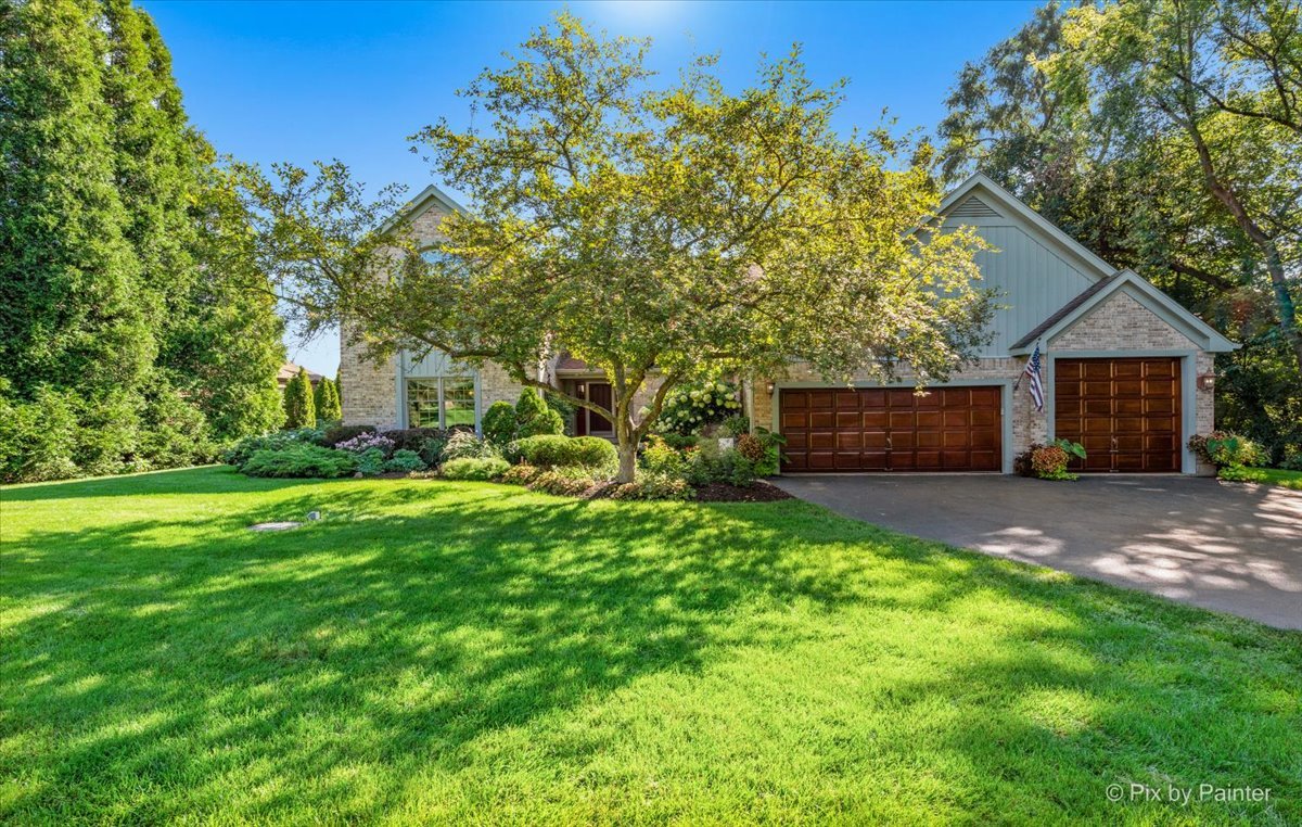 28683 Rivers Edge Drive Cary, IL 60013 - Photo 3 of 31 a view of house with backyard space and garden