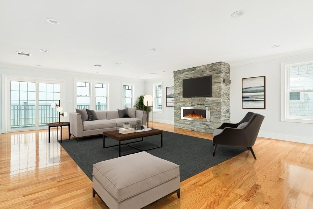 308 Ocean Street Marshfield, MA 02050 - Photo 12 of 42 a living room with furniture a fireplace and a flat screen tv