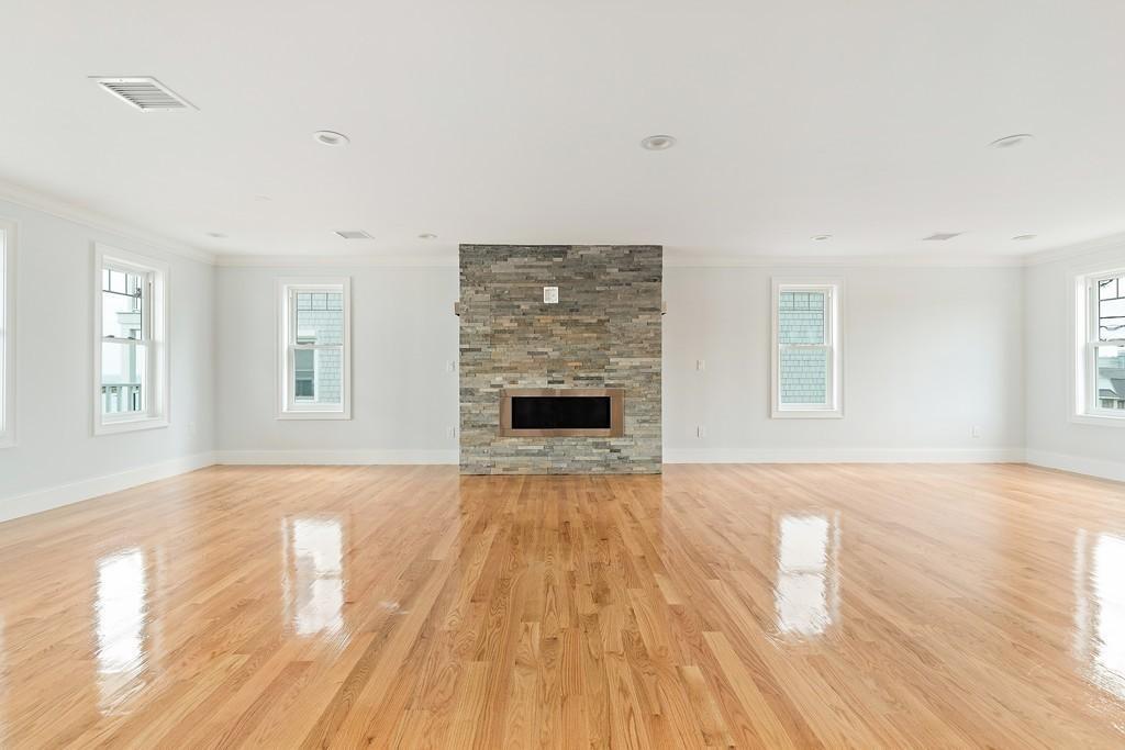 308 Ocean Street Marshfield, MA 02050 - Photo 13 of 42 a view of an empty room with window and wooden floor