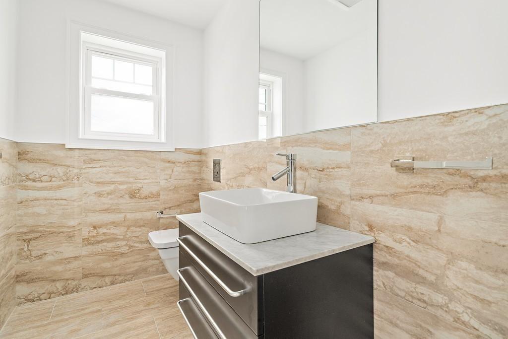 308 Ocean Street Marshfield, MA 02050 - Photo 15 of 42 a bathroom with a sink and a mirror