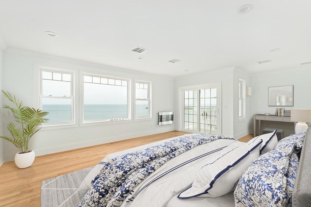 308 Ocean Street Marshfield, MA 02050 - Photo 19 of 42 a bedroom with a bed and wooden floor