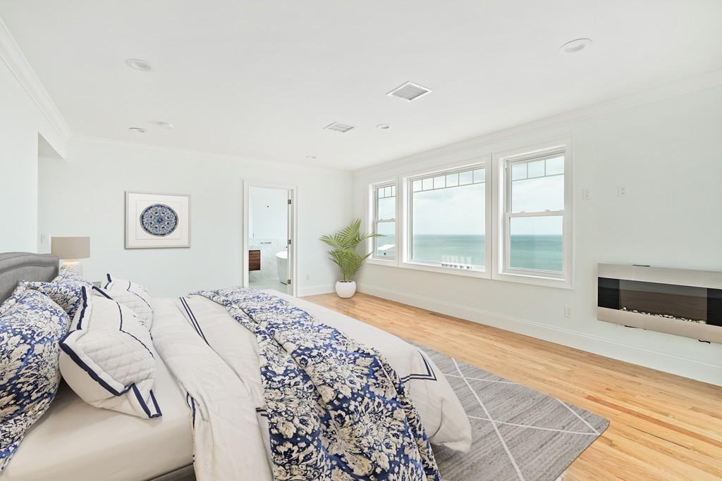 308 Ocean Street Marshfield, MA 02050 - Photo 26 of 42 a bedroom with a large bed and a window