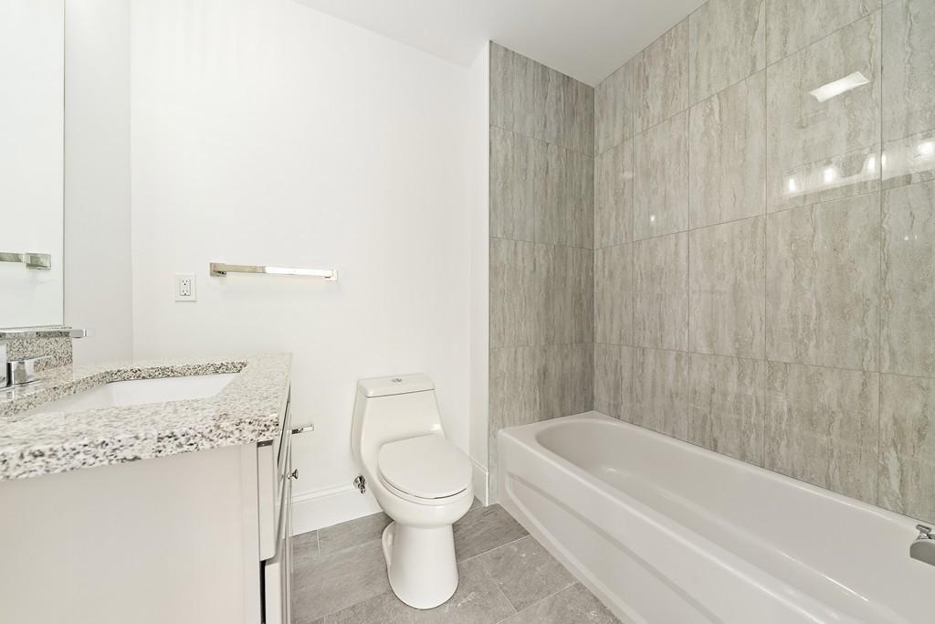 308 Ocean Street Marshfield, MA 02050 - Photo 31 of 42 a bathroom with a toilet and a bathtub