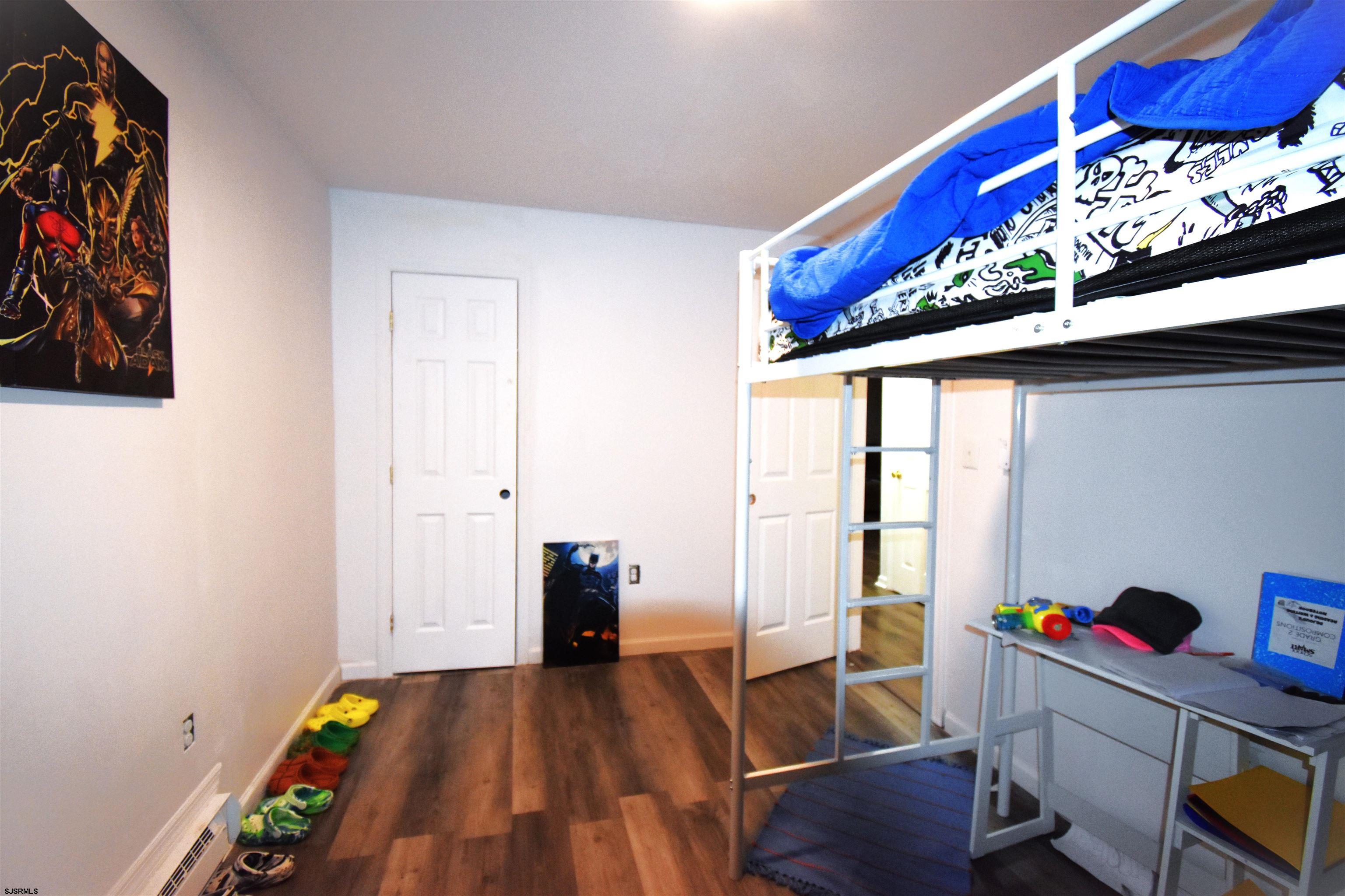 720 6th Road Newtonville, NJ 08346 - Photo 15 of 23 a very nice looking room with a big bed and a window