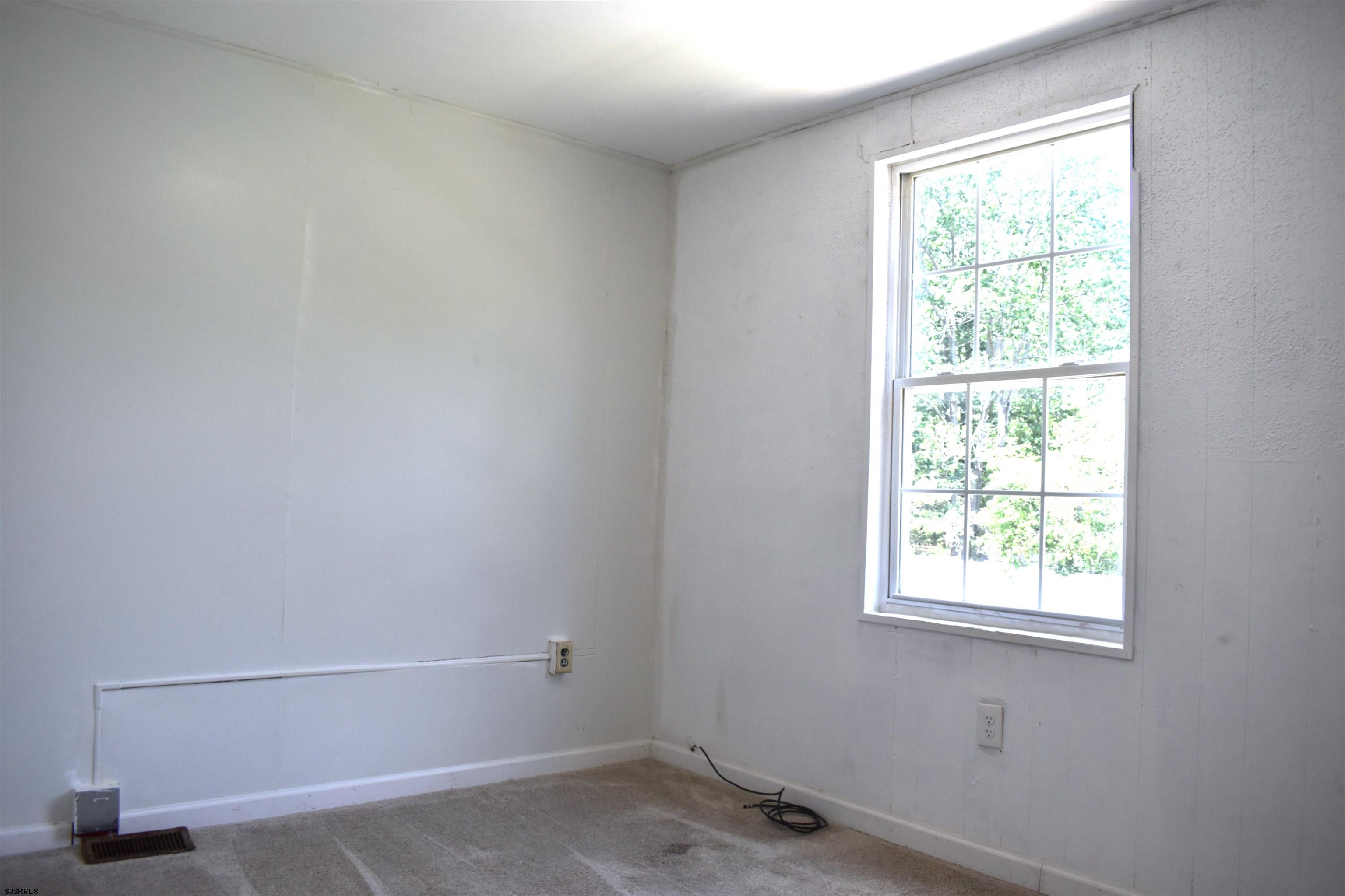 720 6th Road Newtonville, NJ 08346 - Photo 16 of 23 a room with a window and a fan