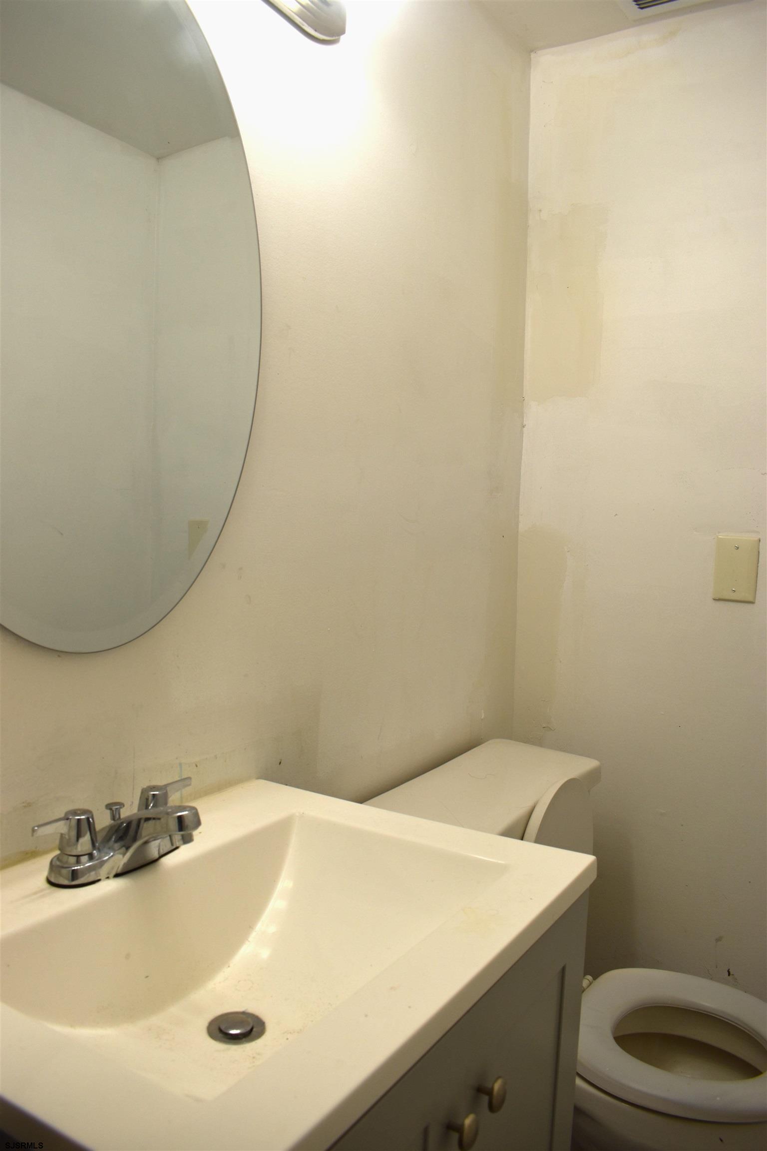 720 6th Road Newtonville, NJ 08346 - Photo 17 of 23 a bathroom with a sink and a toilet