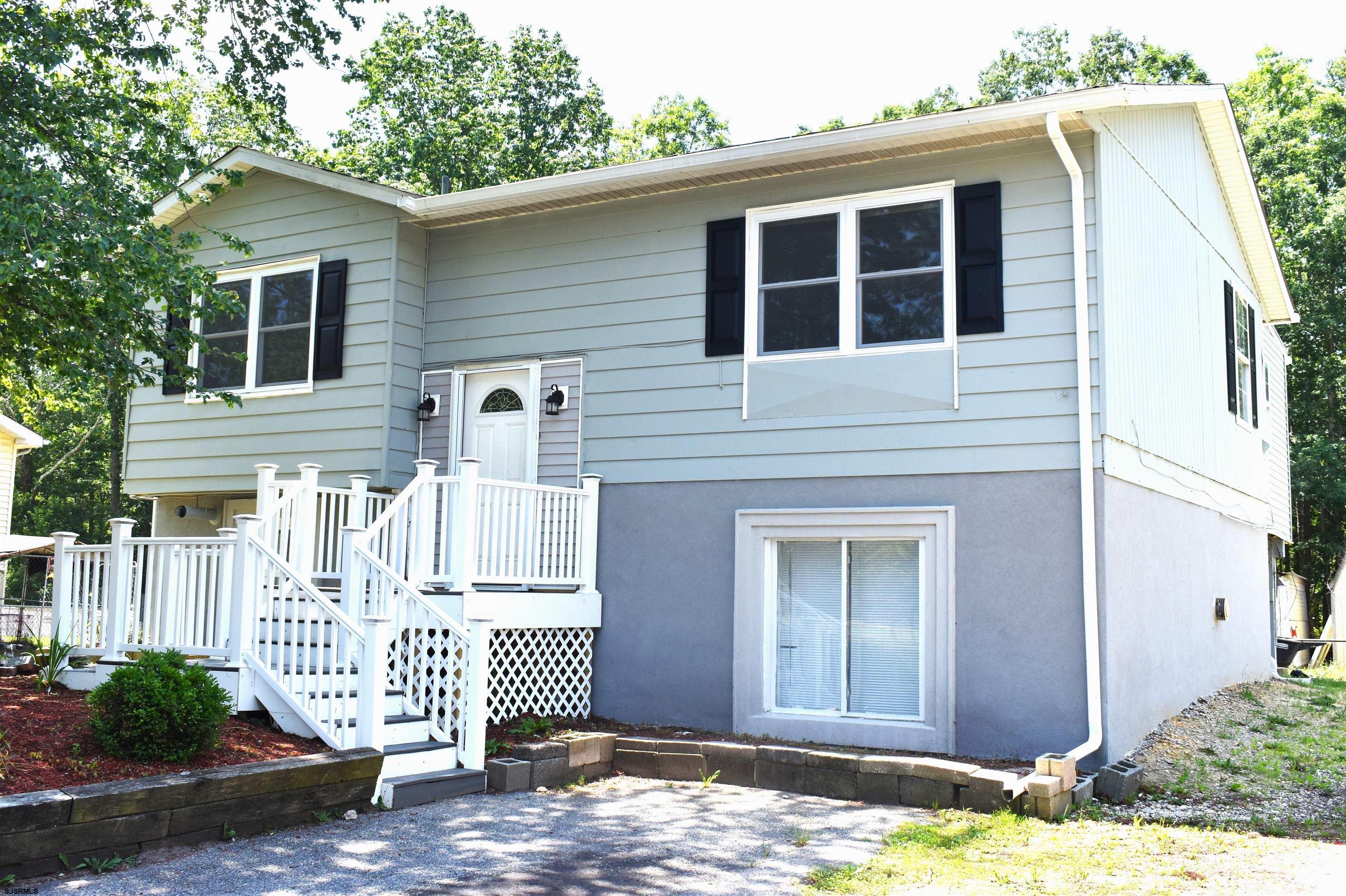 720 6th Road Newtonville, NJ 08346 - Photo 2 of 23 a front view of a house with a yard
