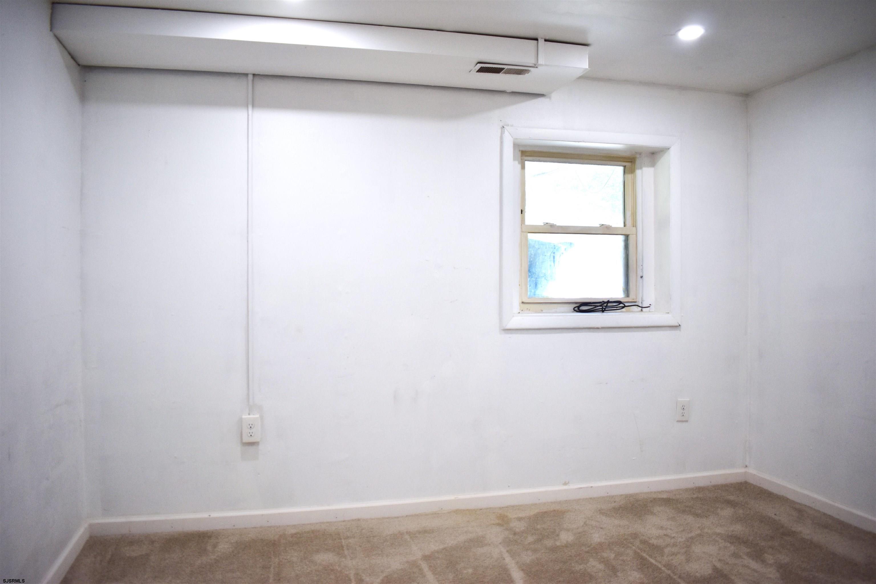 720 6th Road Newtonville, NJ 08346 - Photo 21 of 23 a view of a small space with wooden floor and a window