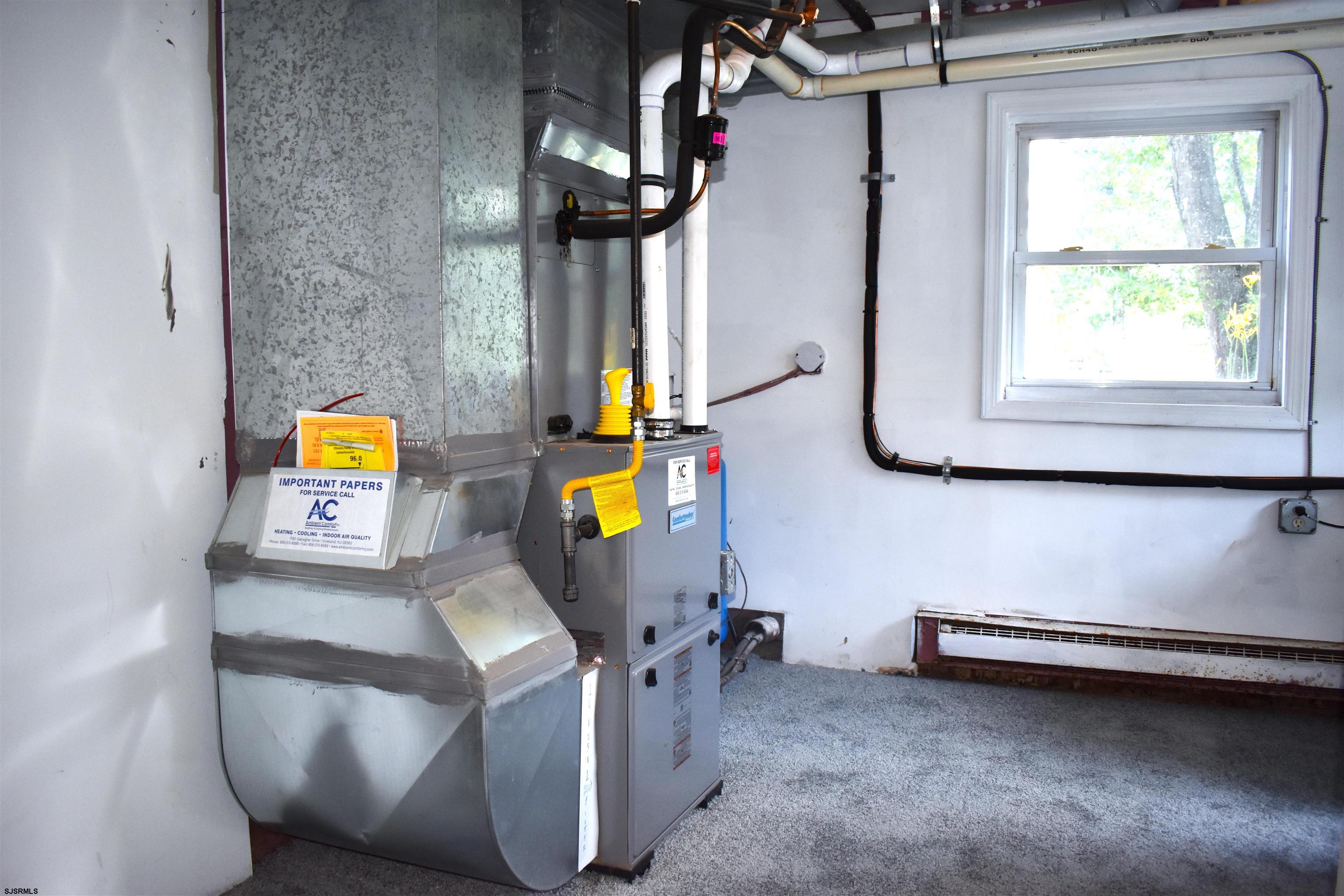 720 6th Road Newtonville, NJ 08346 - Photo 22 of 23 a room with a table and windows