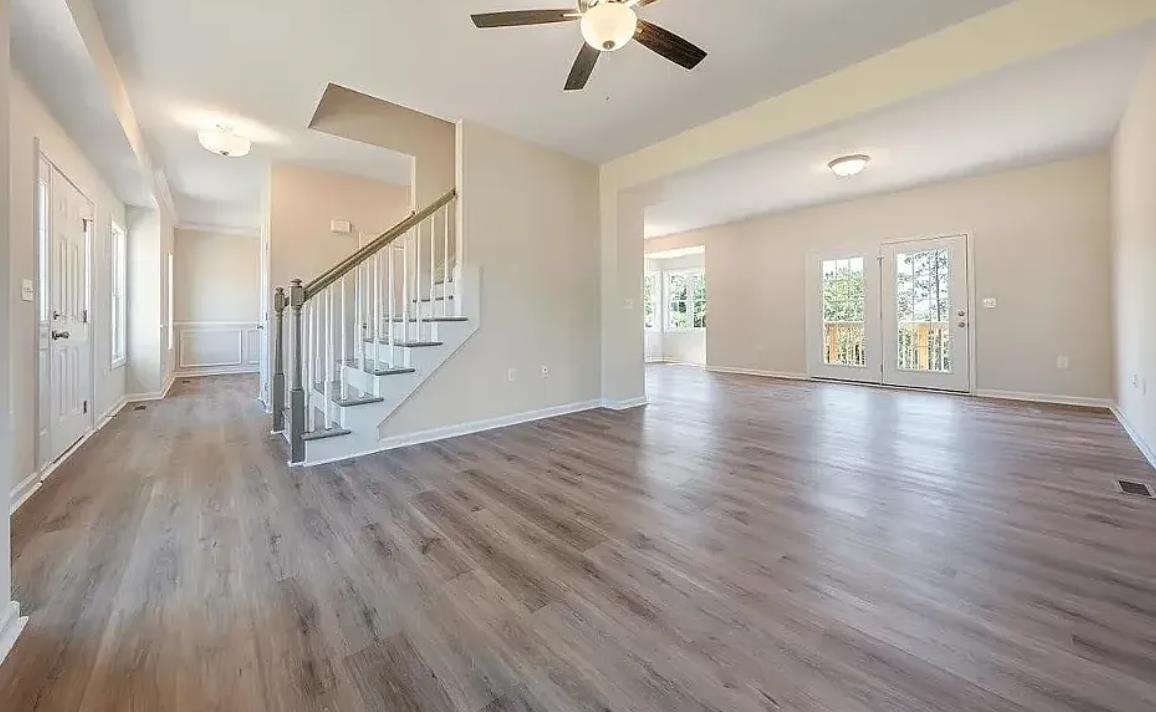 201 Winnbrook Street Staunton, VA 24401 - Photo 2 of 12 a view of an empty room with wooden floor and a chandelier fan