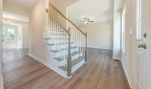 a view of entryway with wooden floor