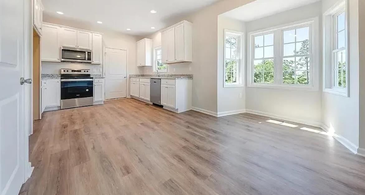 201 Winnbrook Street Staunton, VA 24401 - Photo 5 of 12 a view of kitchen with wooden floor electronic appliances and window