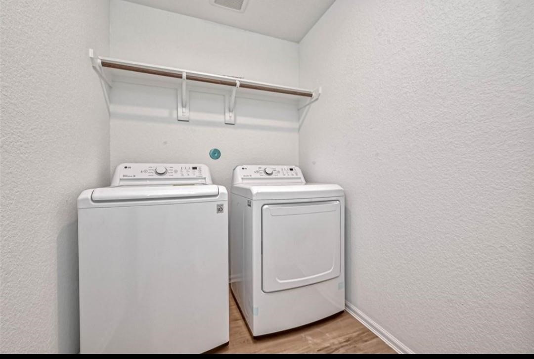 1319 Vincente Court Conroe, TX 77301 - Photo 7 of 10 a utility room with dryer and washer