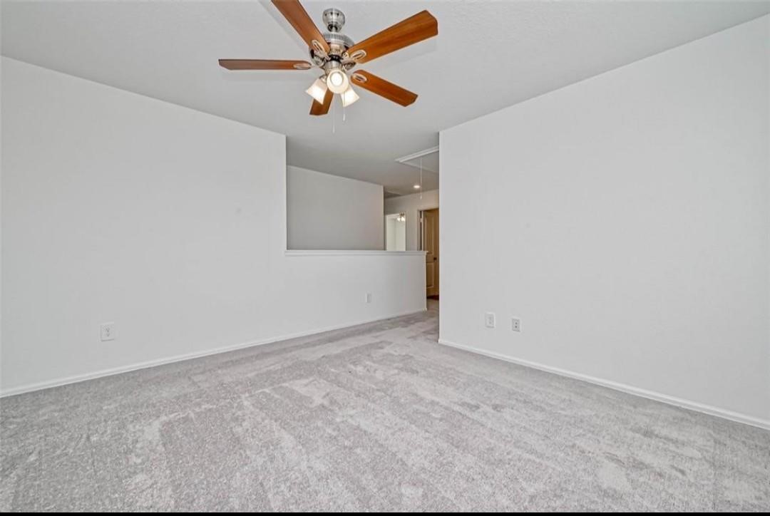 1319 Vincente Court Conroe, TX 77301 - Photo 8 of 10 an empty room with closet and fan