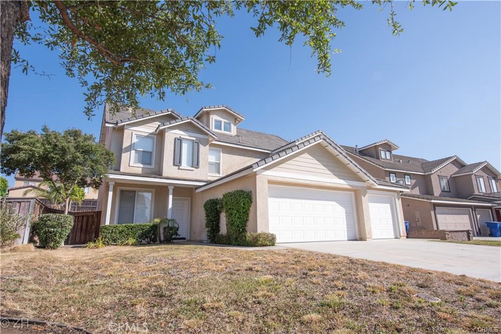 19423 De Marco Road Riverside, CA 92508 - Photo 1 of 1 a front view of a house with a garden