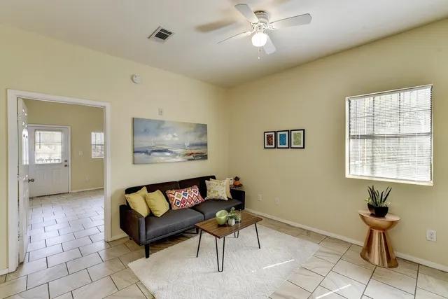 a living room with furniture and a window
