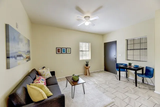 a living room with furniture and a window