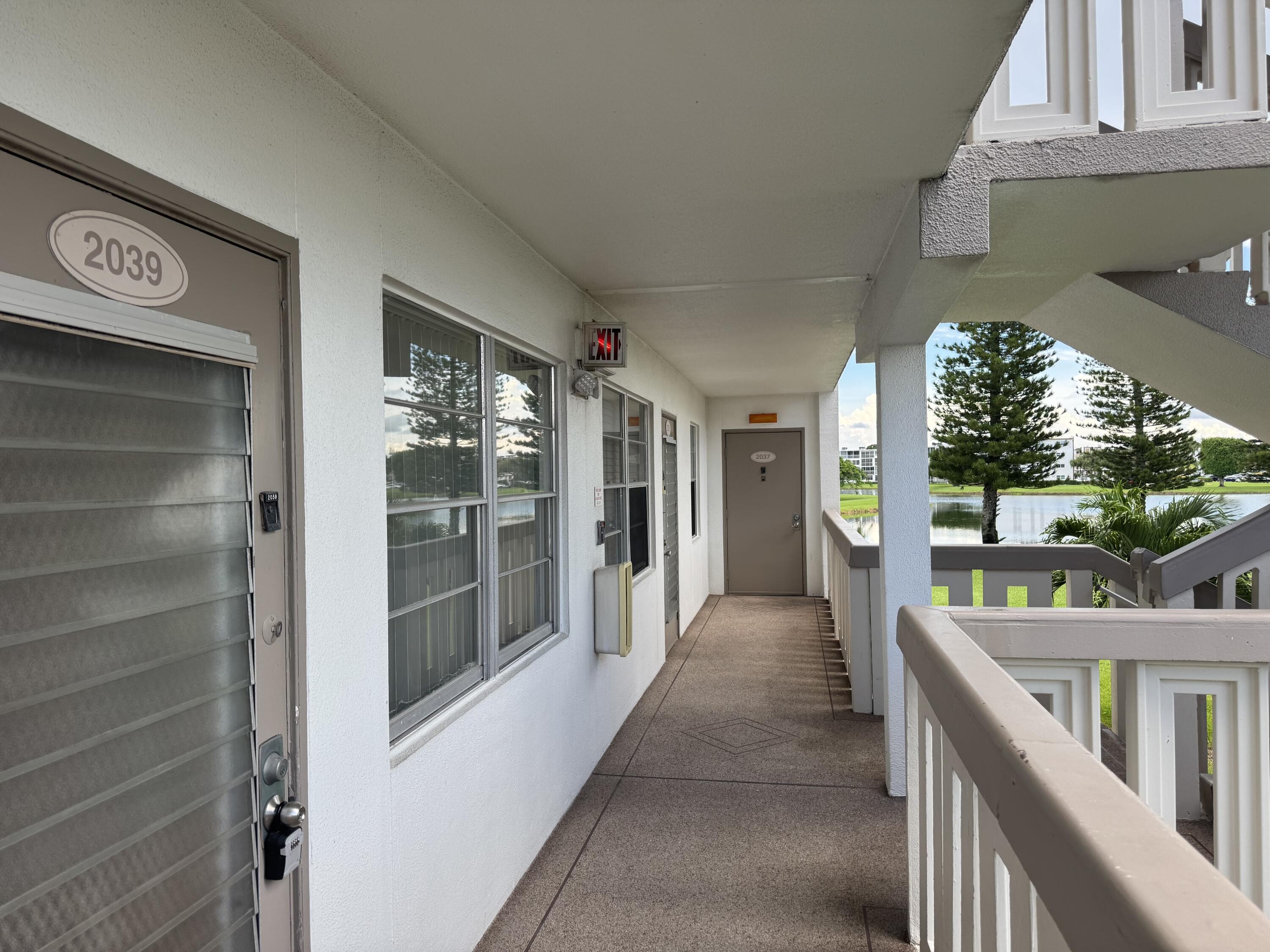 2039 Rexford A, Unit C Boca Raton, FL 33434 - Photo 16 of 27 condo right near stairs
