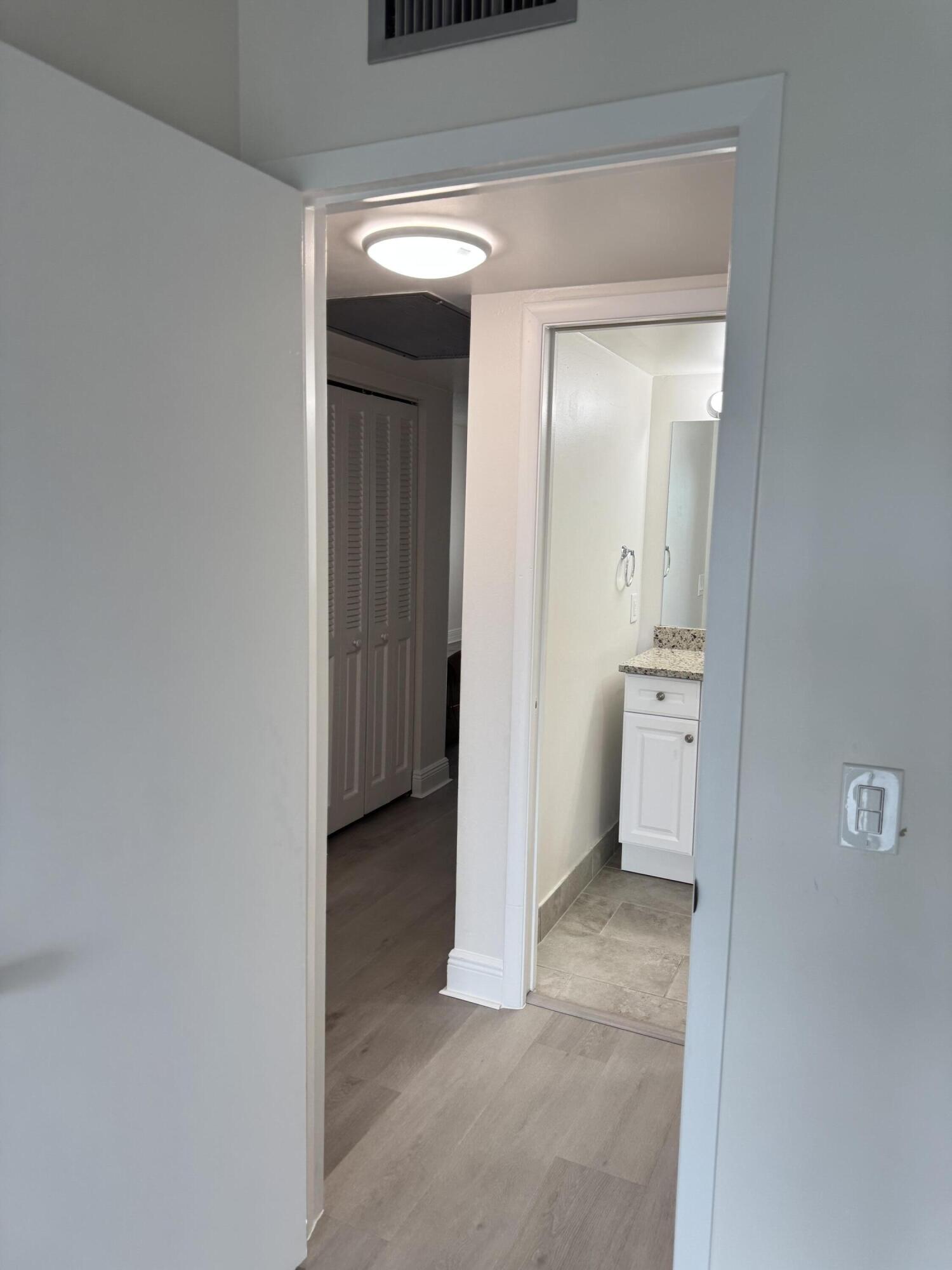 2039 Rexford A, Unit C Boca Raton, FL 33434 - Photo 22 of 27 hallway to guest bath