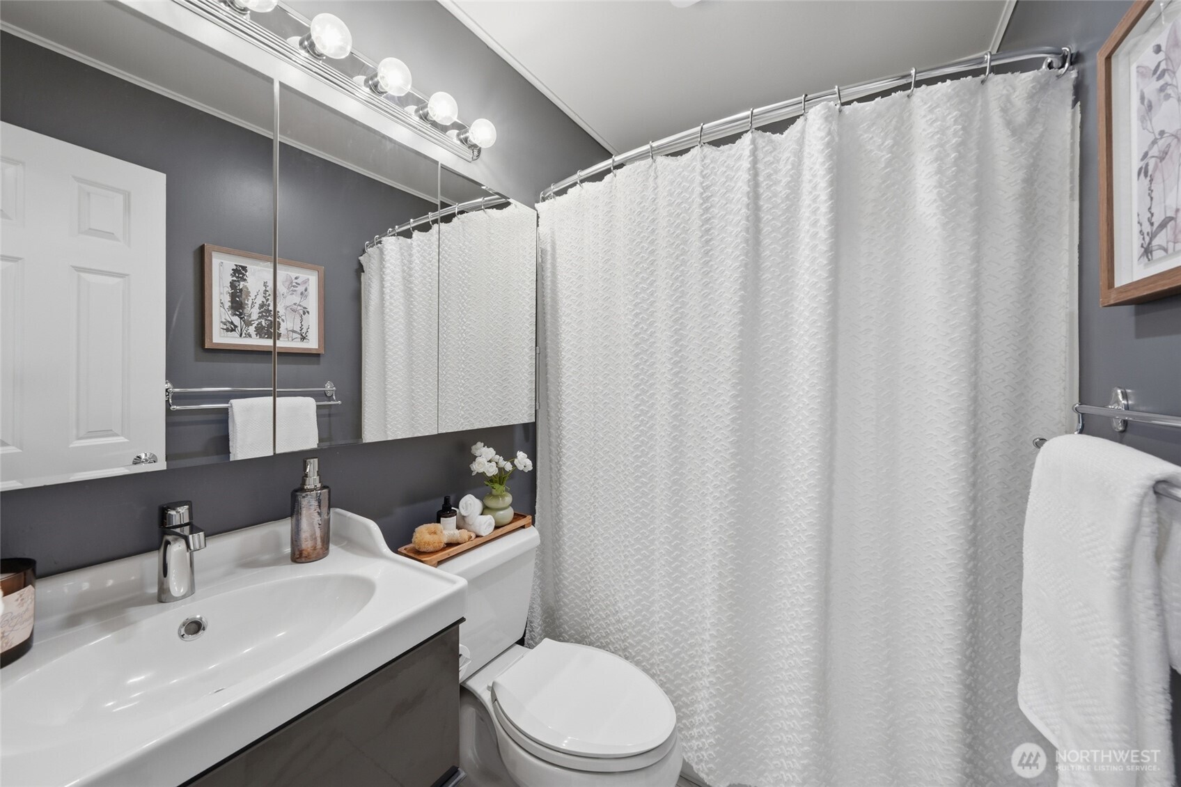 1425 Jones Avenue Northeast Renton, WA 98056 - Photo 13 of 36 a bathroom with a sink toilet and shower