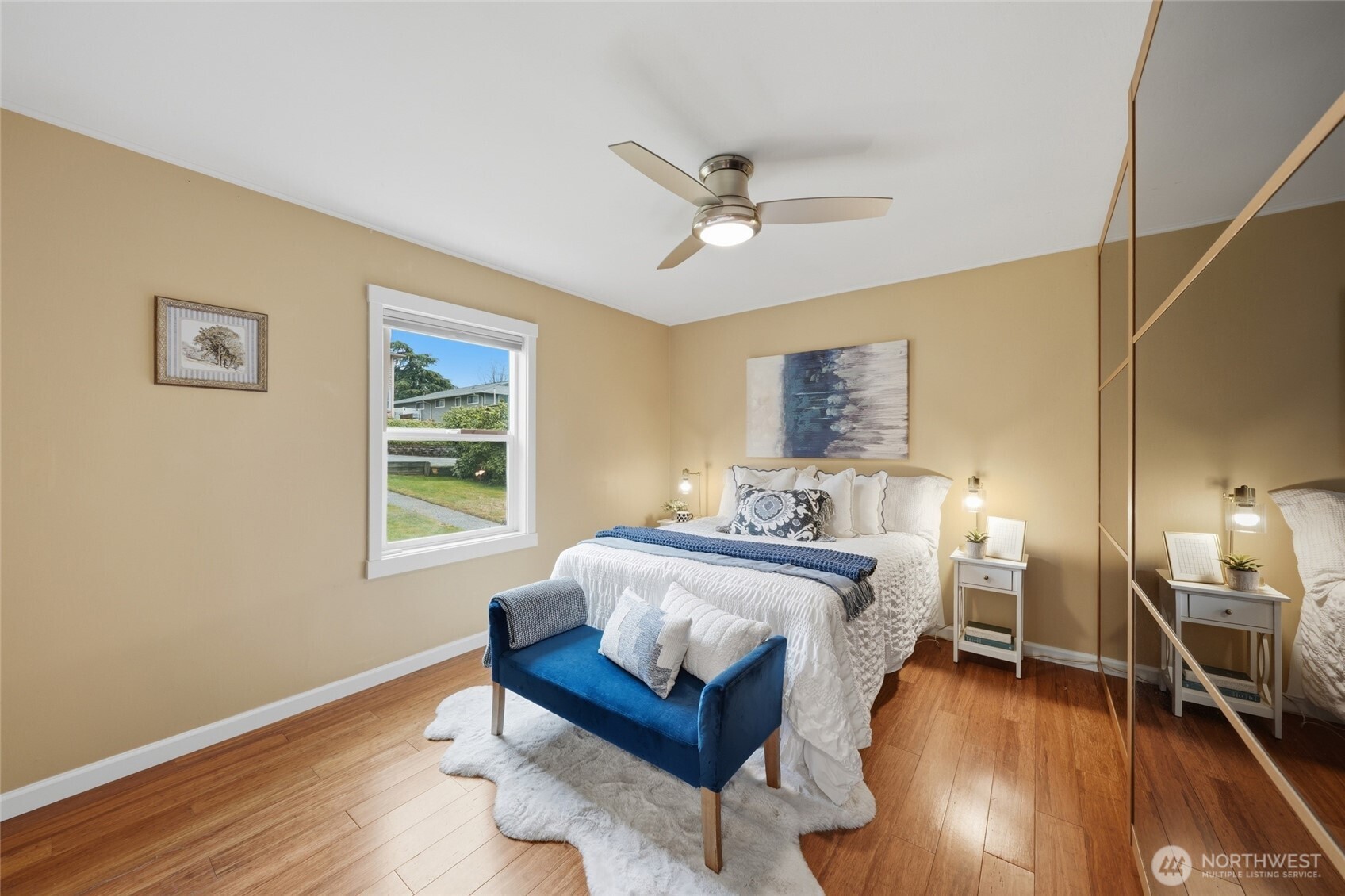 1425 Jones Avenue Northeast Renton, WA 98056 - Photo 14 of 36 a spacious bedroom with a bed and wooden floor