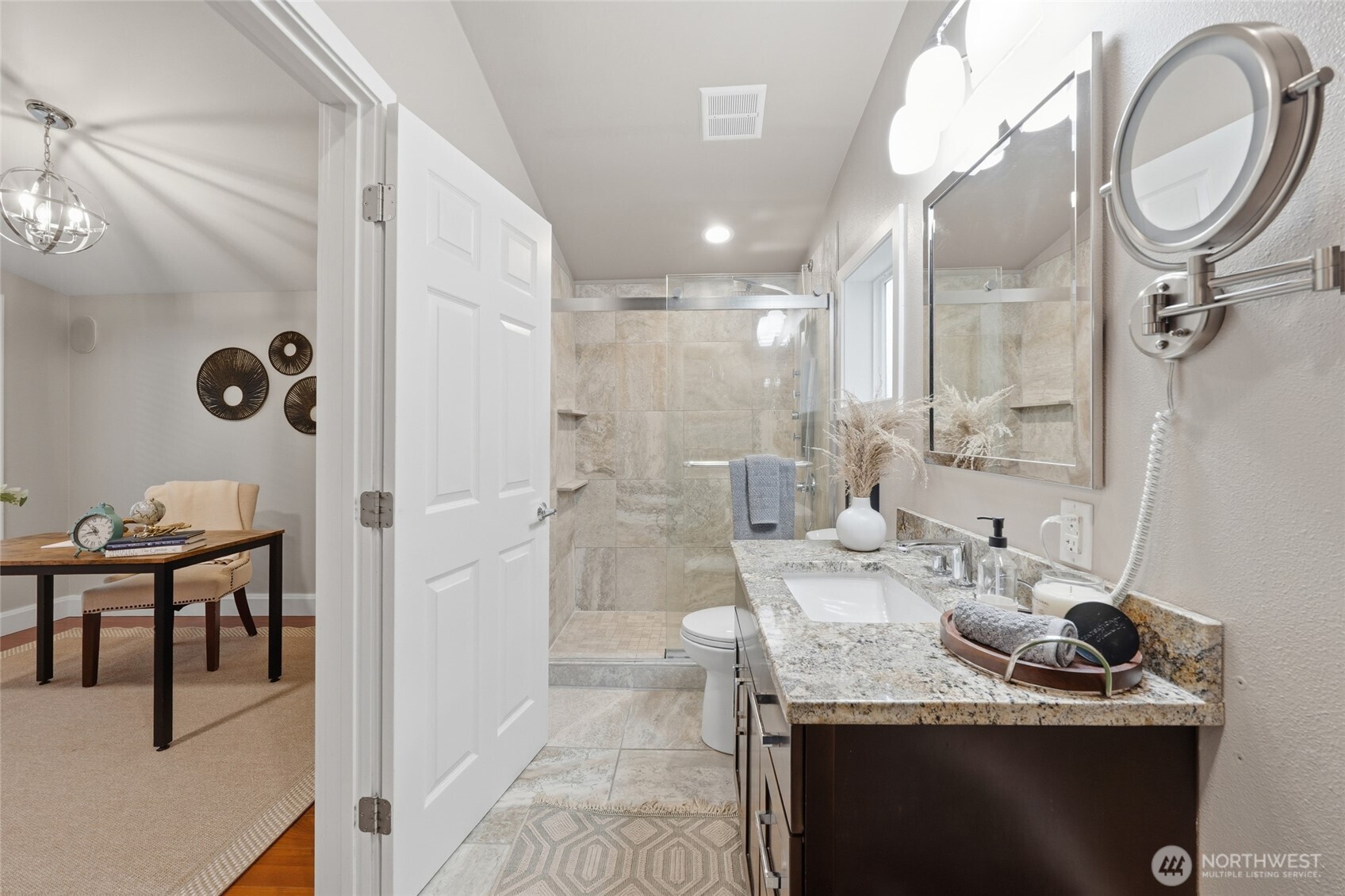 1425 Jones Avenue Northeast Renton, WA 98056 - Photo 17 of 36 a bathroom with a granite countertop sink a mirror and a shower