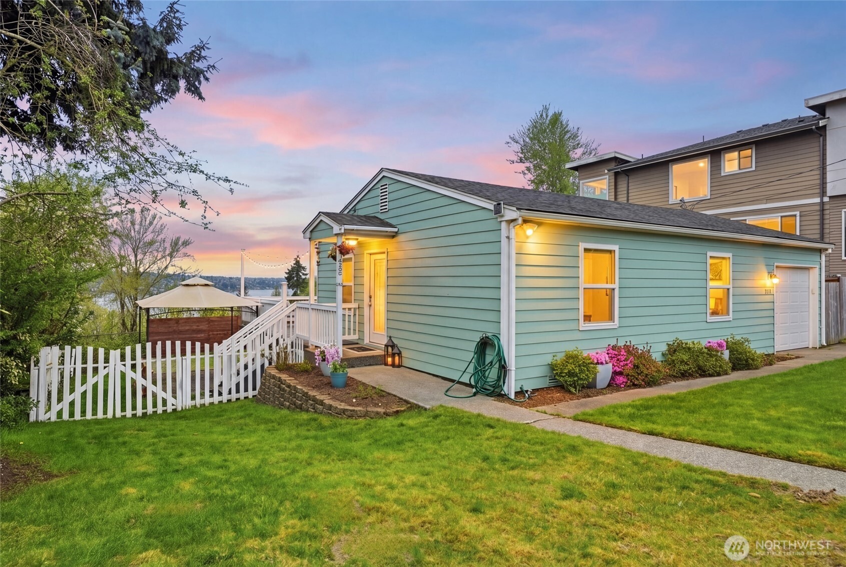 1425 Jones Avenue Northeast Renton, WA 98056 - Photo 2 of 36 a front view of a house with garden