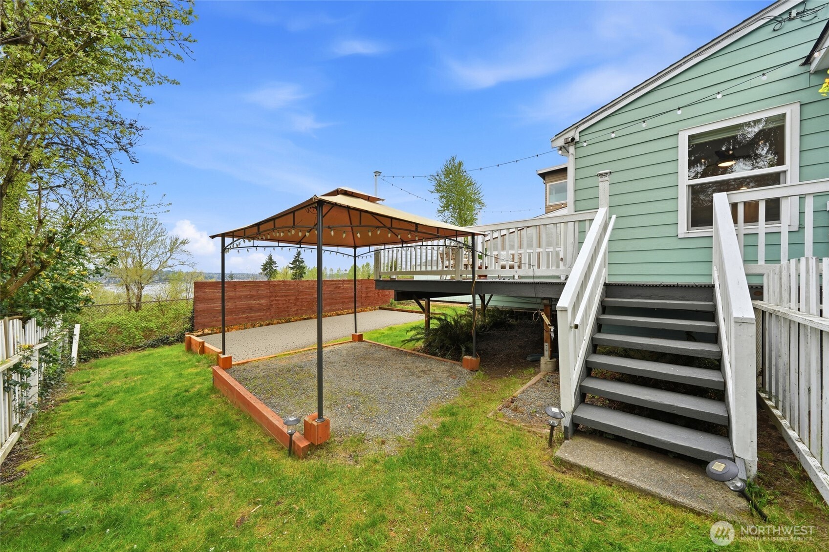 1425 Jones Avenue Northeast Renton, WA 98056 - Photo 22 of 36 a view of a house with a backyard