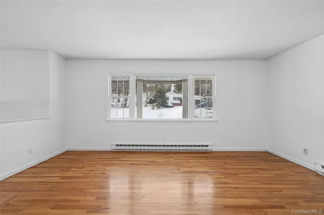 a kitchen with a refrigerator stove and wooden cabinets