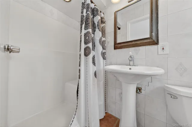 a bathroom with a toilet and a sink