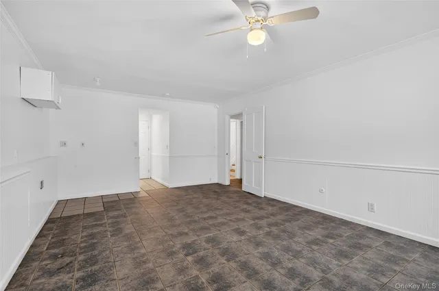 a view of a kitchen with refrigerator and a sink