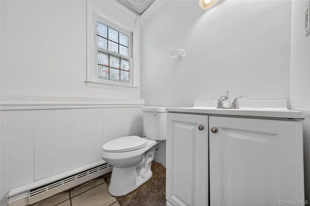 a view of a room with wooden floor and window