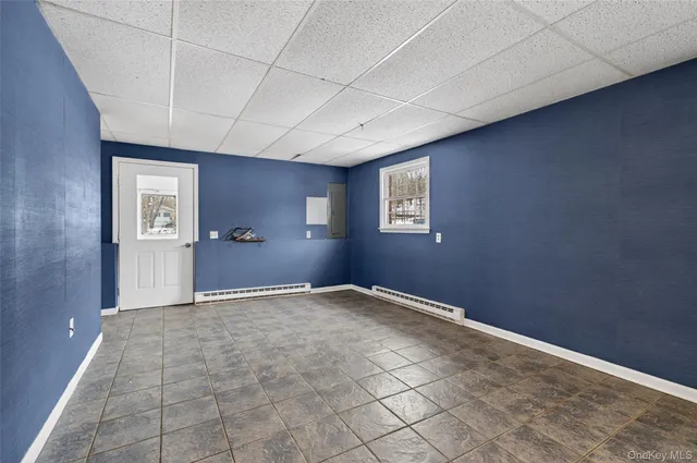 a kitchen with a stove sink and cabinets