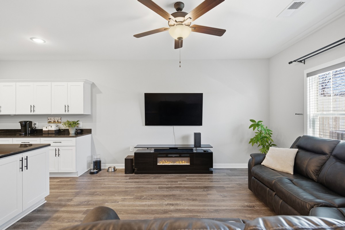 1279 Bluebird Road Lebanon, TN 37087 - Photo 11 of 33 a living room with furniture and a flat screen tv