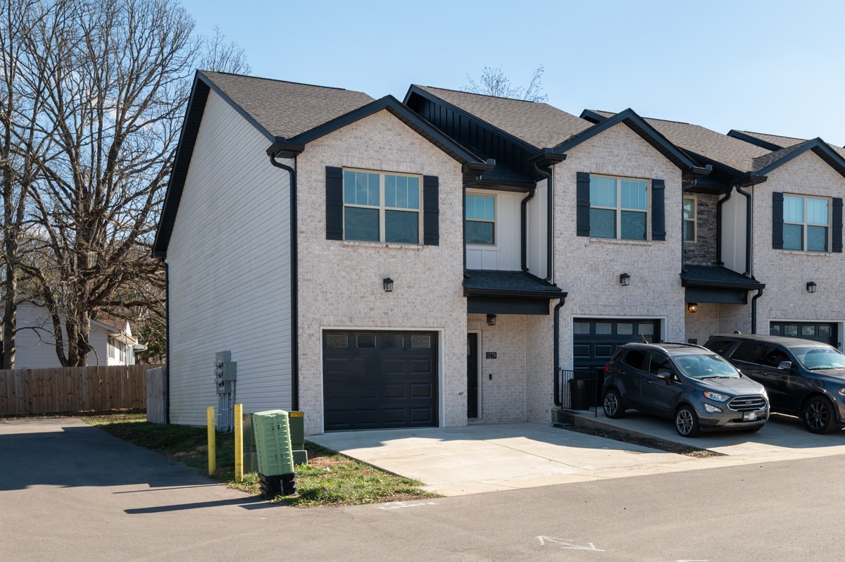 1279 Bluebird Road Lebanon, TN 37087 - Photo 2 of 33 a front view of a house with a yard