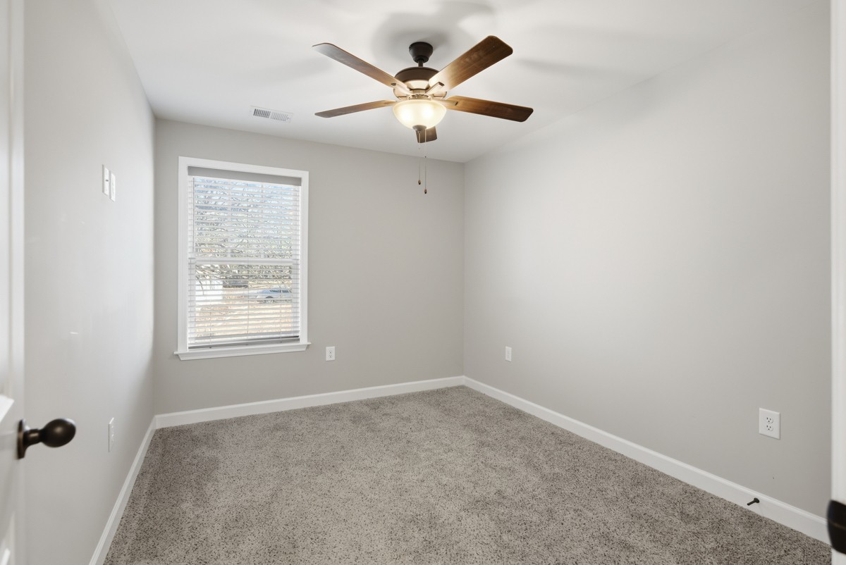1279 Bluebird Road Lebanon, TN 37087 - Photo 25 of 33 an empty room with a window and a ceiling fan