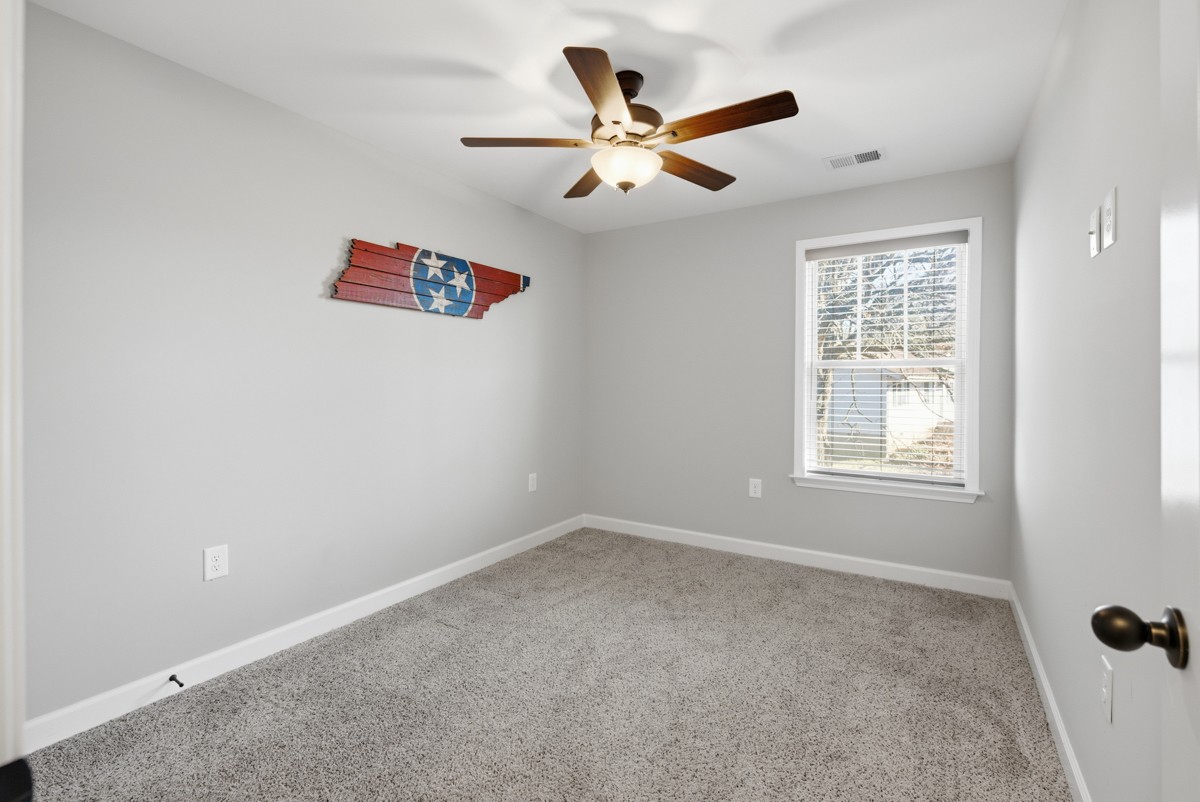 1279 Bluebird Road Lebanon, TN 37087 - Photo 27 of 33 an empty room with a window and a fan