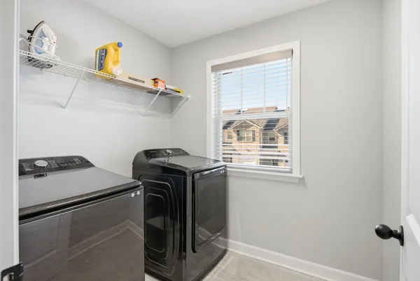 a utility room with dryer and washer