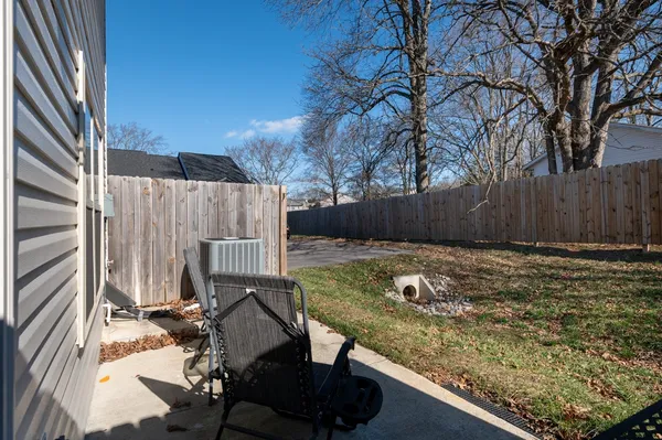 a view of swimming pool with a yard and sitting area