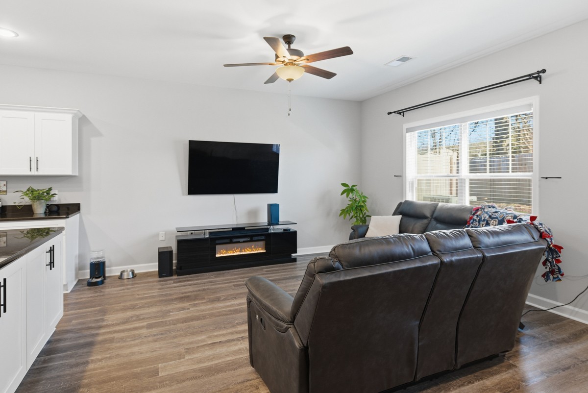 1279 Bluebird Road Lebanon, TN 37087 - Photo 9 of 33 a living room with furniture and a flat screen tv