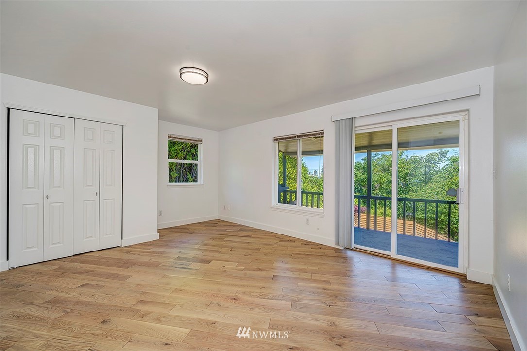 1809 Holbrook Avenue Everett, WA 98203 - Photo 30 of 40 a view of an empty room with wooden floor and a window