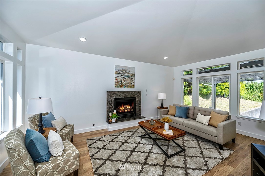 1809 Holbrook Avenue Everett, WA 98203 - Photo 9 of 40 a living room with furniture and a fireplace