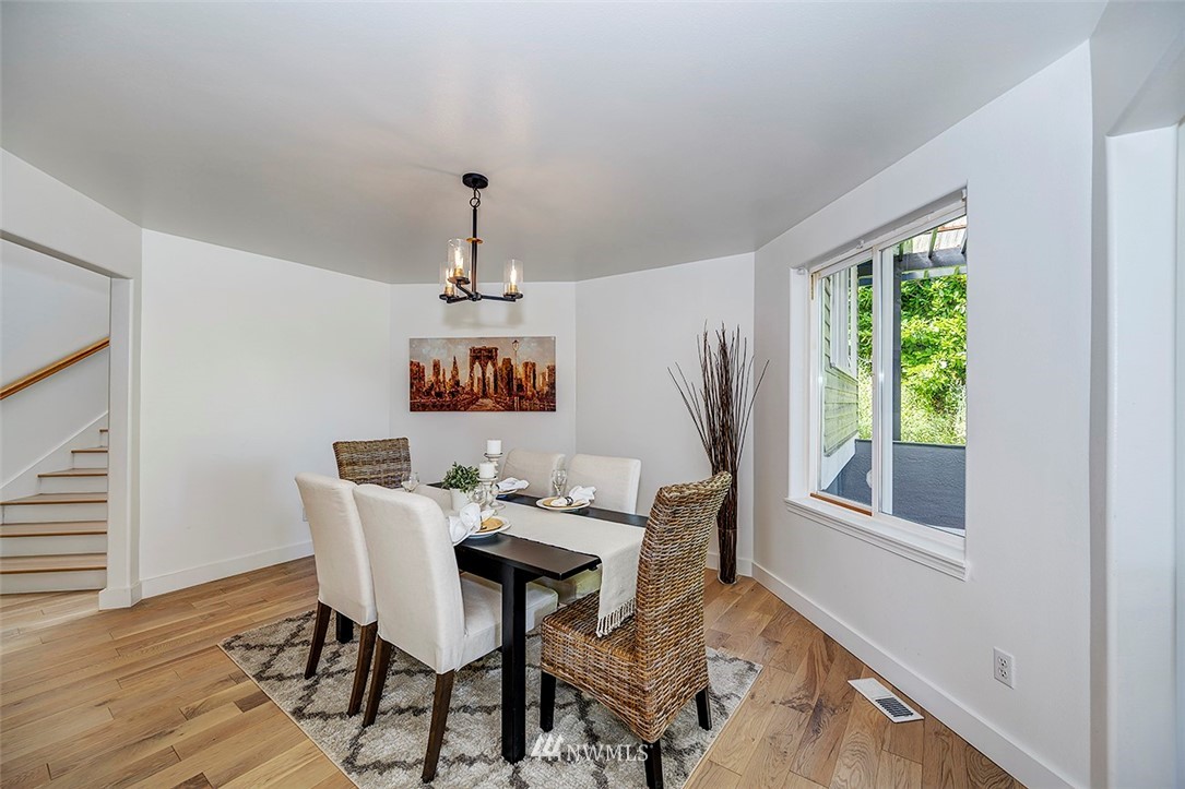 1809 Holbrook Avenue Everett, WA 98203 - Photo 10 of 40 a view of a dining room with furniture window and wooden floor