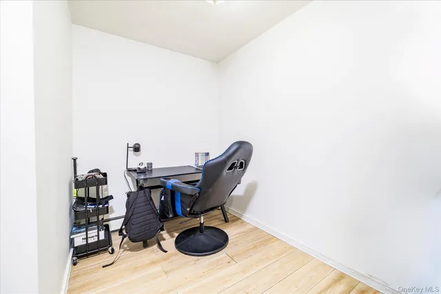 a view of workspace with wooden floor