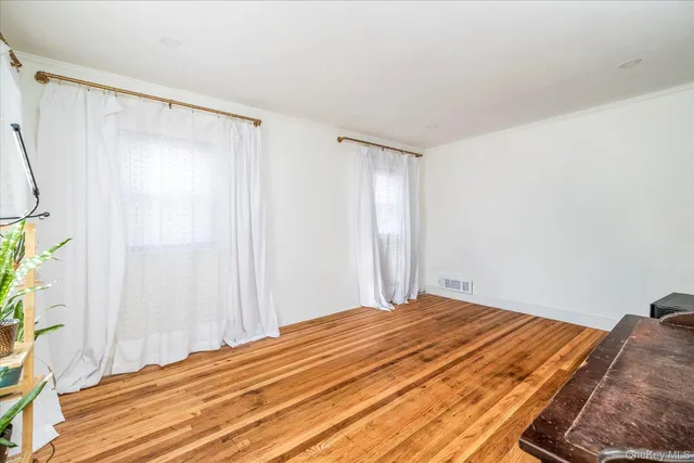a bathroom with a granite countertop sink a mirror and a shower